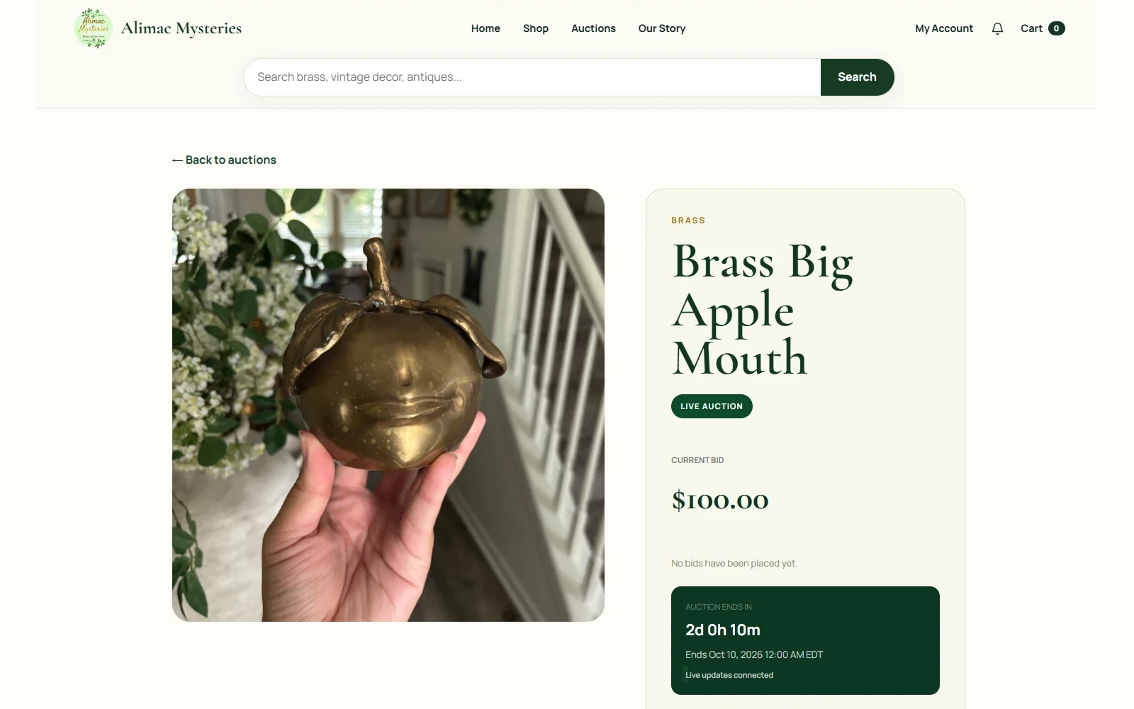 Alimac Mysteries live auction page showing the current bid and a countdown to the auction ending